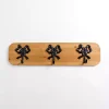 Kirklands Home Wood and Metal Bow Wall Hooks